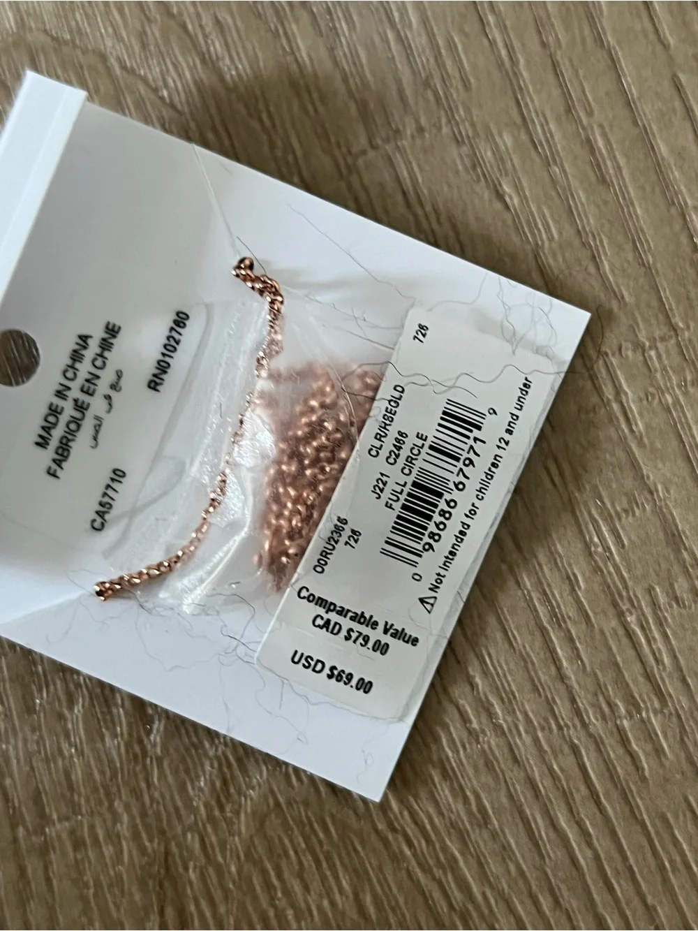 Kate Spade rose gold circle pendant necklace with clear stones and stud earrings